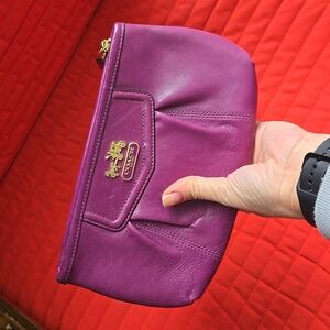 COACH Signature Sufflette leather clutch bag in purple